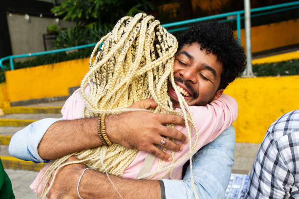 Man hugging friend in social gathering