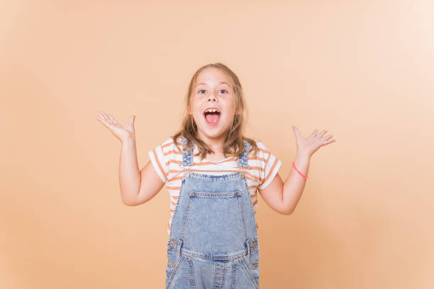 istock GIRL SMILING IN SURPRISED ATTITUDE 1720836288