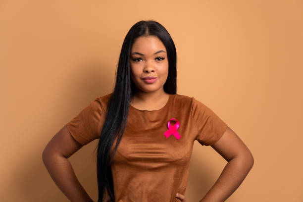 istock black woman wearing pink ribbon 1720840146
