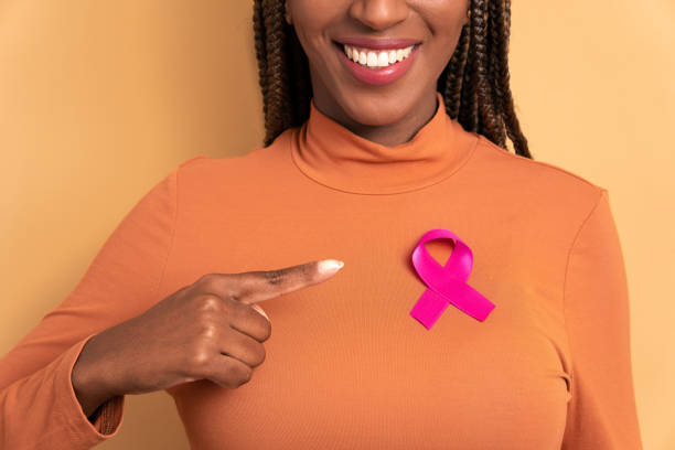 istock hands woman pointing pink ribbon 1720840150