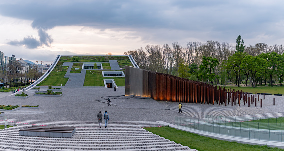 Budapest, Hungary - April 24, 2023: A picture of the Museum of Ethnography Green Roof and the Memorial of the 1956 Revolution at sunset.