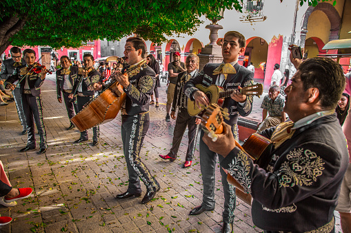 El Pajar, Gran Canaria, Canary Islands, Spain - April 6, 2024 - Romeria de Santa Agueda - Men, women and boys playing and singing on the street during the celebration