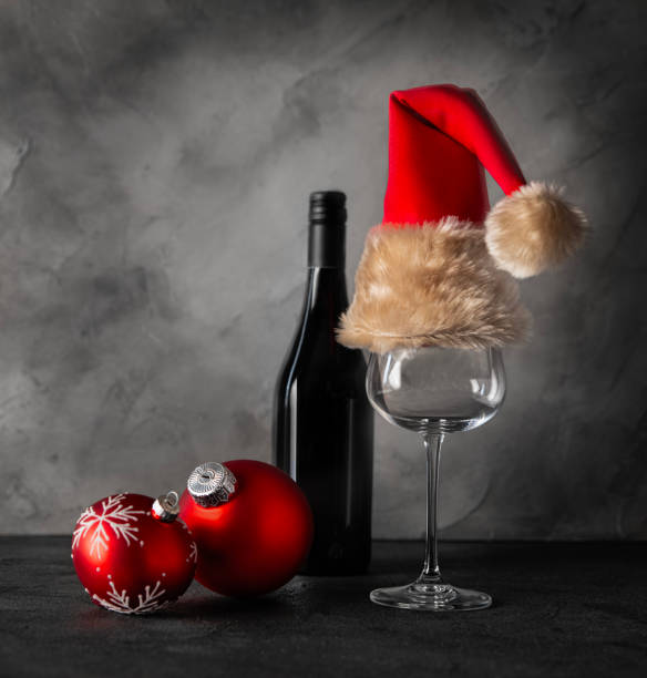 istock Bottle with wine, glass and red balls 1720876184