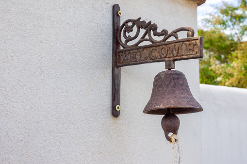 Rustic Welcome Bell: Space for Your Message.