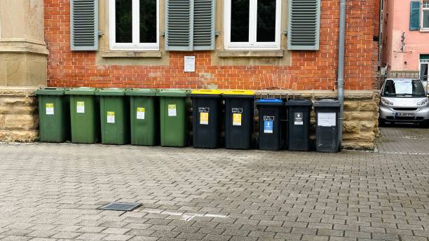 Garbage cans in a row stock photo
