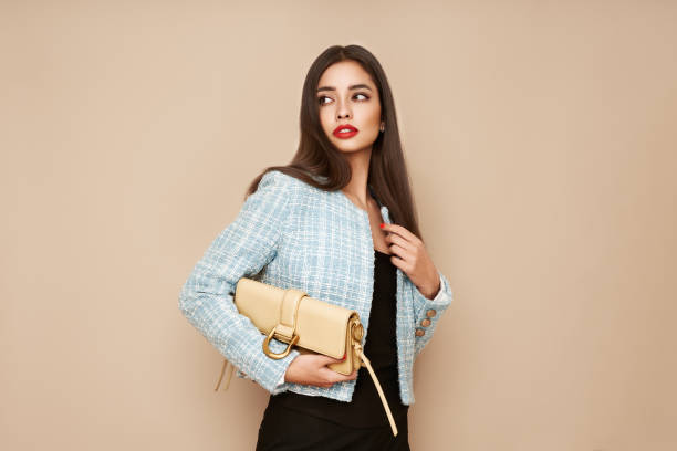 istock Young brunette woman in blue jacket 1720892785