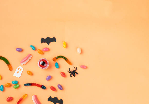istock Colorful candies over orange background with copy space 1720914298