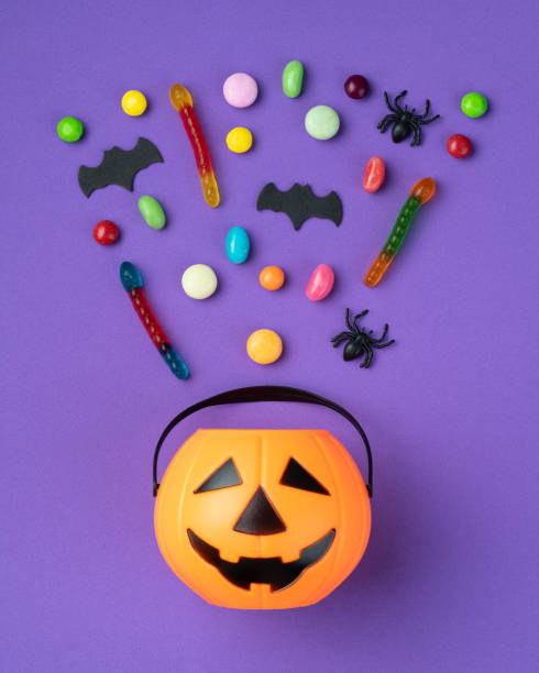 istock Assorted colorful candies over purple background 1720914830