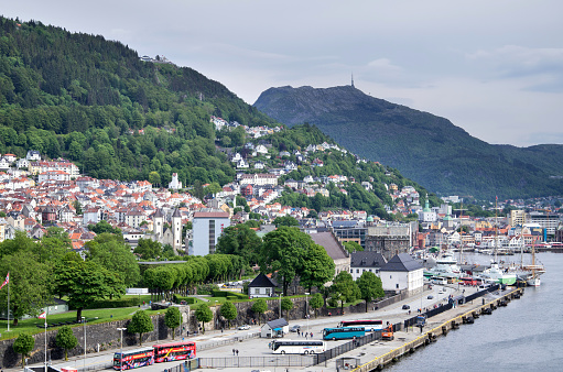 Bergen, Norway - June 6, 2017: Seaside view of Bergen with Mounta Floyen and Ulriken. Bergen is the second-largest city in Norway.