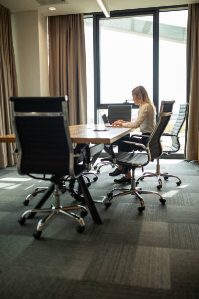 istock Business woman working on laptop in modern office 1720978816