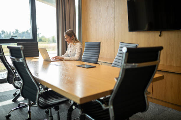 istock Business woman working on laptop in modern office 1720979340