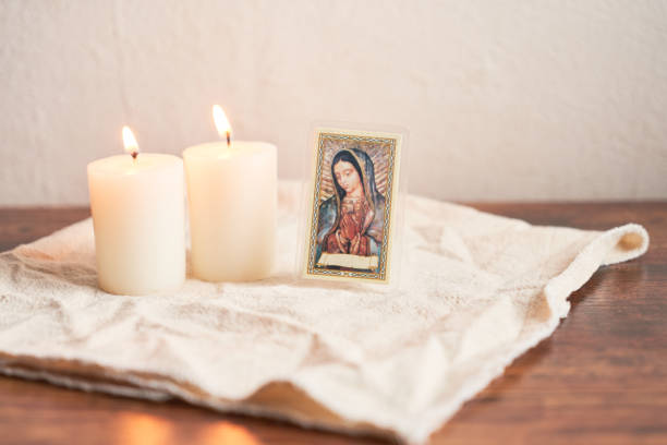 istock Virgen de guadalupe with candles, religious image of mexico. 1720991954