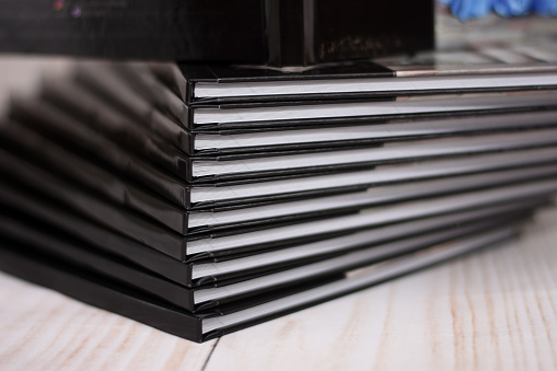 Photobook Album with Photos. large stack of paper books.