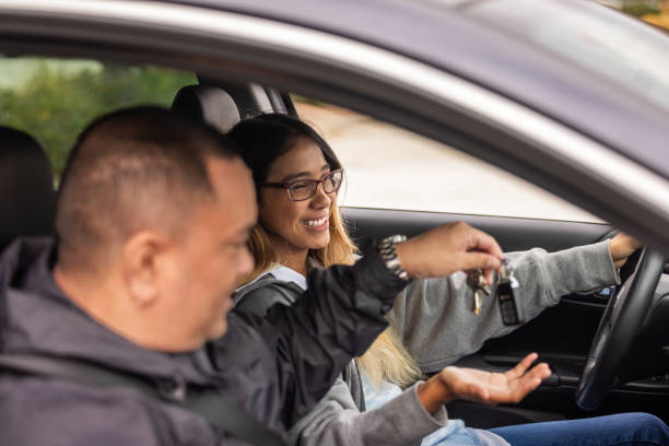 istock Father Teaching Daughter to Drive 1721033016