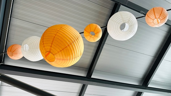 Orange lanterns hanging at the ceiling