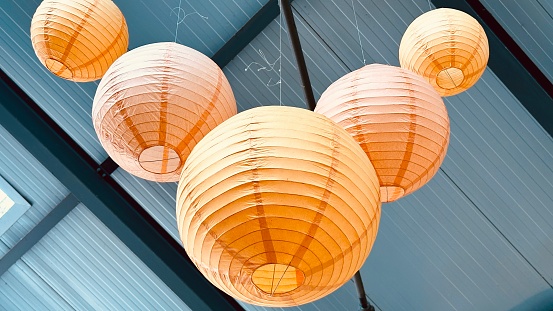 Orange lanterns hanging at the ceiling