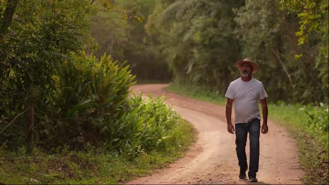 Mature man walking on a rural scene