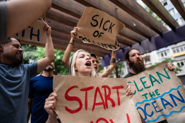istock Environmentalists people protesting at city street 1721099283