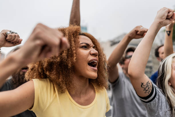 istock People protesting in the street 1721103766