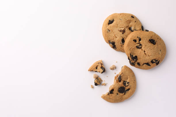 istock Delicious chocolate chip cookies on white background, flat lay. Space for text 1721117684
