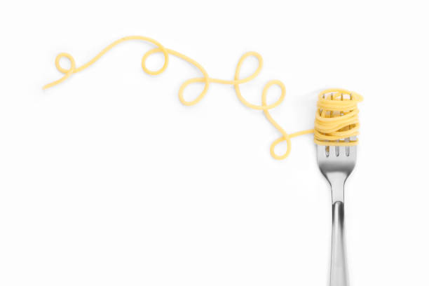istock Fork with tasty pasta on white background, top view. Space for text 1721119980
