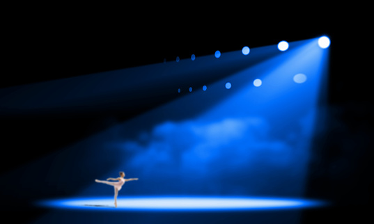 a ballerina under the spotlight