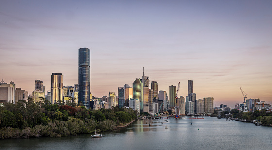 Brisbane city sunrise over the Brisbane River showing the cityscape and new bridge construction