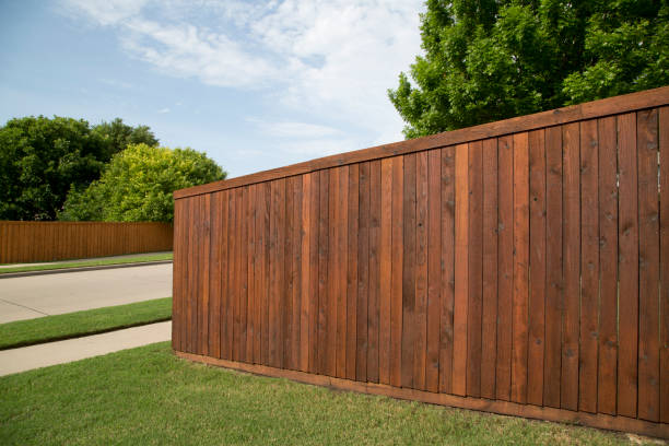 istock Nice new wooden fence around house 1721154787