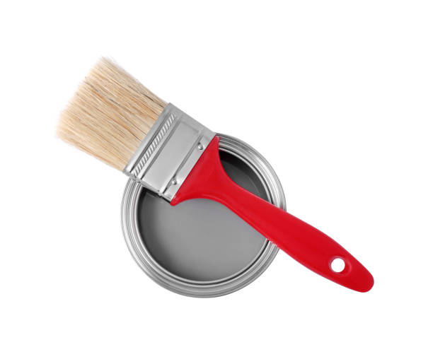istock Can with gray paint and brush on white background, top view 1721176947