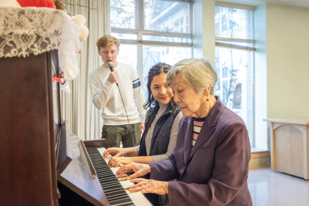 istock Multiracial Multi-Generation Extended Family Making Music, Playing Piano, Singing Together 1721198515