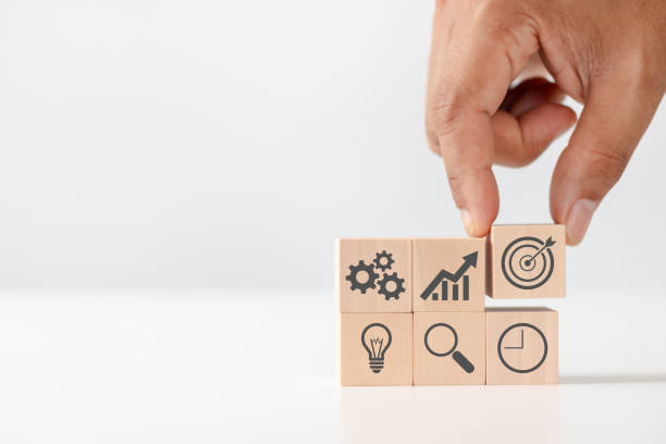 istock Product development, analysis and market validation. MVP, minimum viable product concept for lean startup. Hand arranging wooden cubes with icon new product launch, business strategy and Action plan. 1721198519