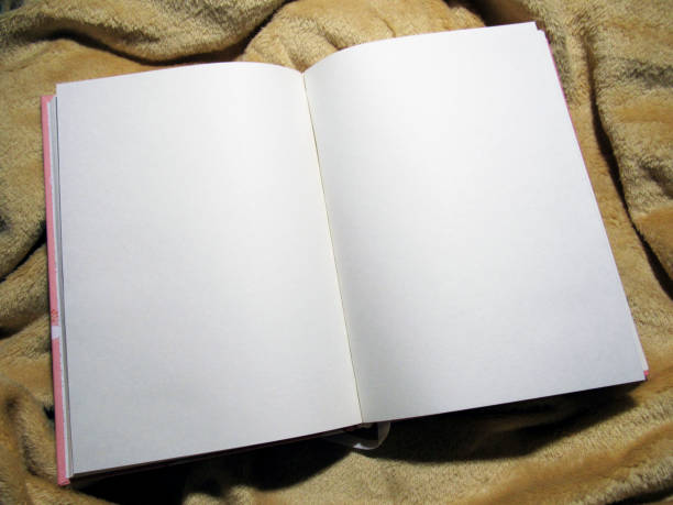 istock Open notebook with blank white paper pages on cozy blanket 1721200152