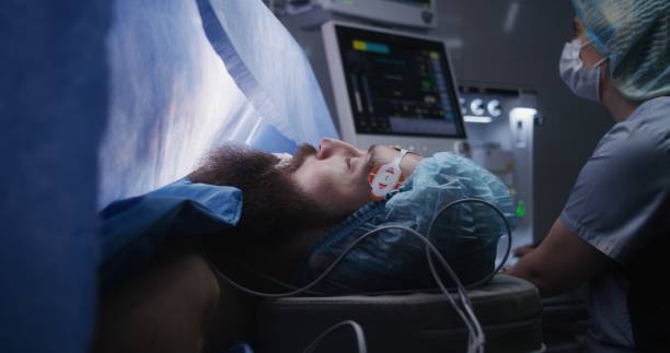 istock Close up of patient lying on surgical table 1721200696