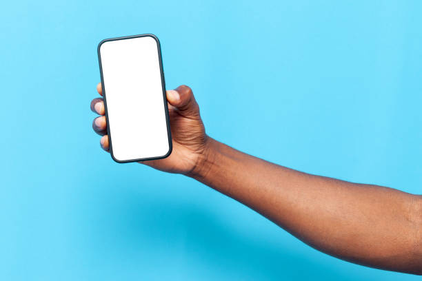 istock african american man's hand holding smartphone with blank screen on blue isolated background 1721202310