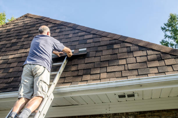 istock Mature man repairing asphalt shingle roof 1721208350