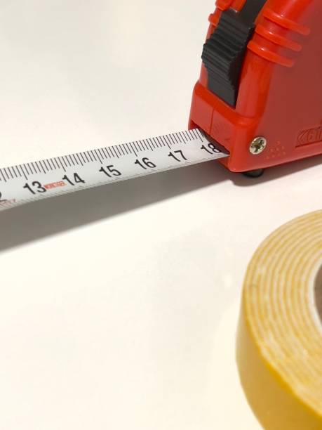 istock Length measurer and glue on white background. 1721208361