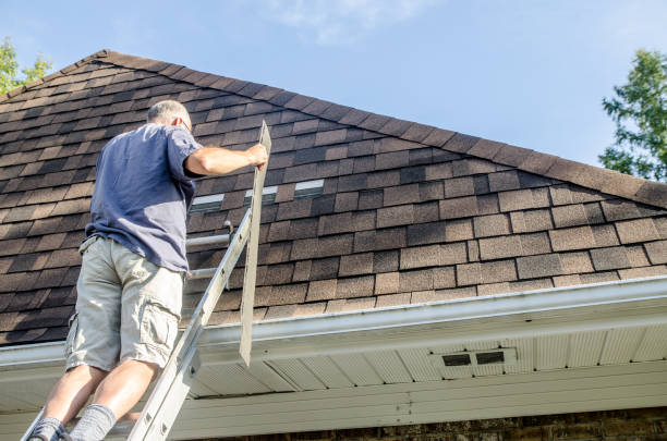 istock Mature man repairing asphalt shingle roof 1721208910