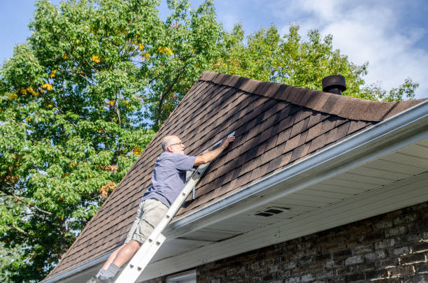 istock Mature man repairing asphalt shingle roof 1721209479