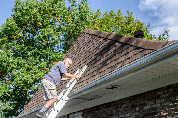 istock Mature man repairing asphalt shingle roof 1721210572
