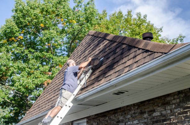 istock Mature man repairing asphalt shingle roof 1721211662