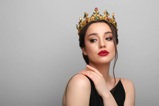 istock Beautiful young woman wearing luxurious crown on light grey background, space for text 1721212192