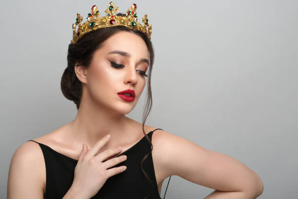 istock Beautiful young woman wearing luxurious crown on light grey background, space for text 1721212200