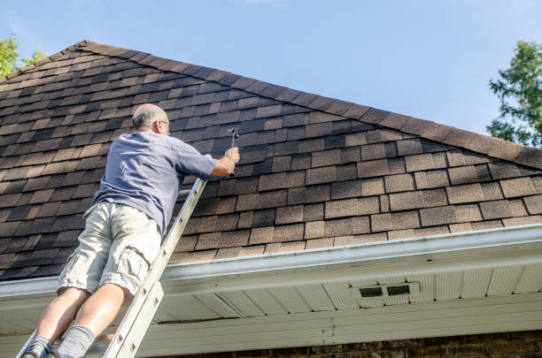 istock Mature man repairing asphalt shingle roof 1721212209