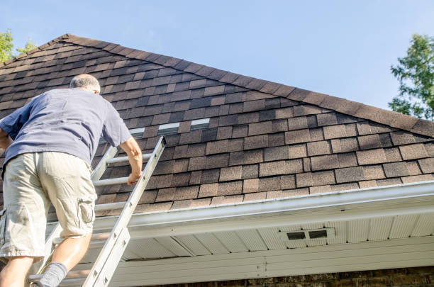 istock Mature man repairing asphalt shingle roof 1721212756