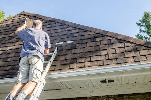 istock Mature man repairing asphalt shingle roof 1721213295
