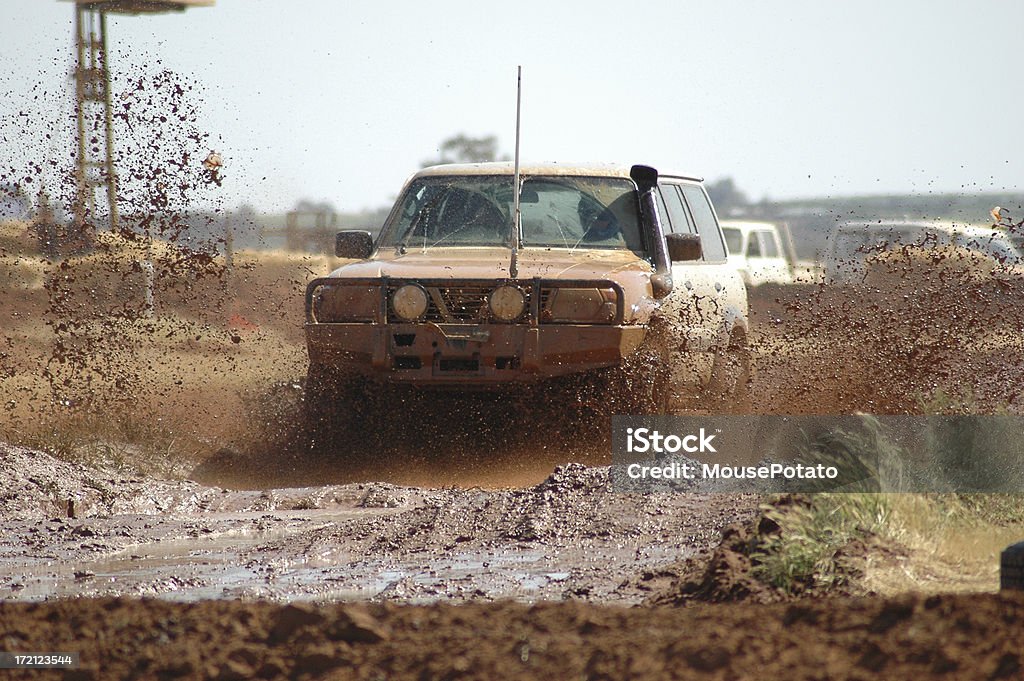 Offroad Racing A 4x4 vehicle ploughs through  the mud during an off-road race event. 4x4 Stock Photo