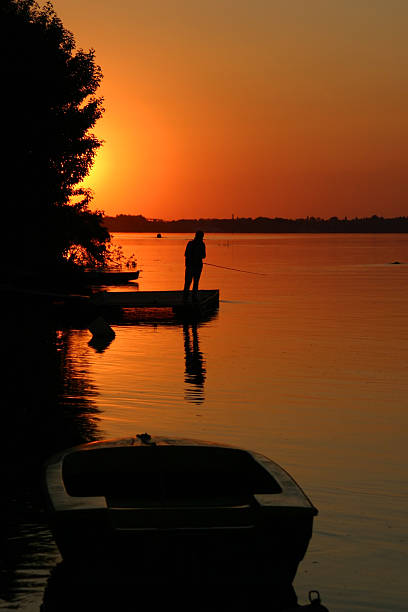 istock Lonely fisherman on the Danube river 172123753