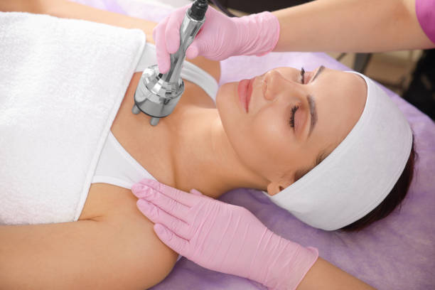 istock Young woman undergoing cosmetic procedure in beauty salon. Microcurrent therapy 1721237693