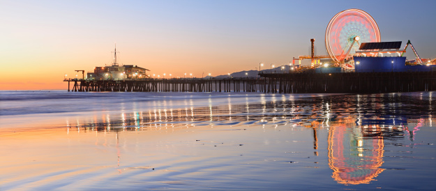 The Santa Monica Pier is located at the foot of Colorado Avenue. It is a prominent southern California  landmark.The pier contains an amusement park, an original carousel 1920s, an Aquarium, shops, entertainers, a video arcade and restaurants. The west end of the pier is a popular location for anglers.