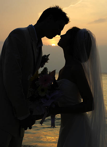 istock bride and groom kissing 172124440